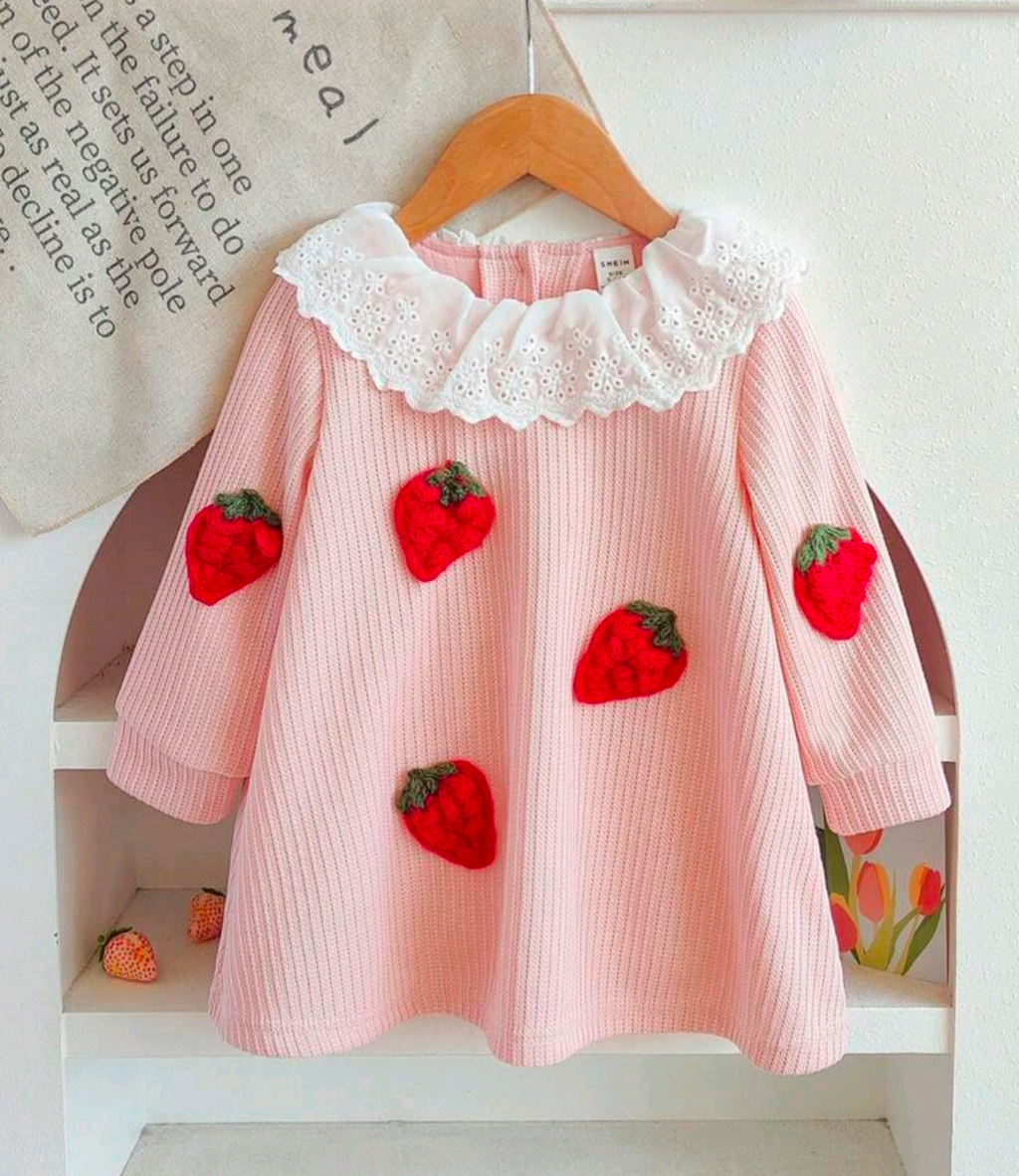 Pink strawberry dress with white eyelet ruffle collar, front view