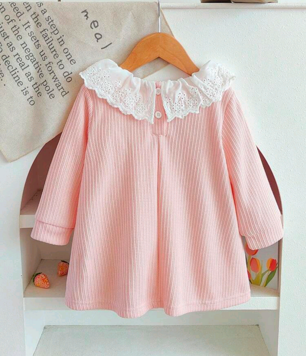 Back view of pink dress with white ruffle collar